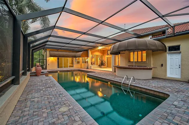 a view of a house with a backyard