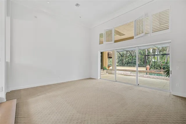 a view of room with window and chandelier