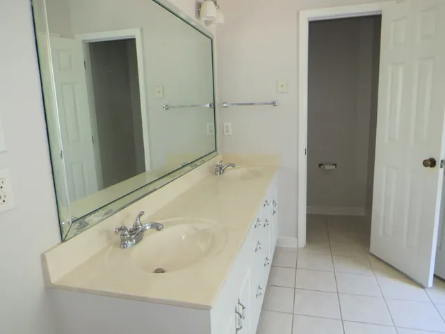 a bathroom with a shower and a sink
