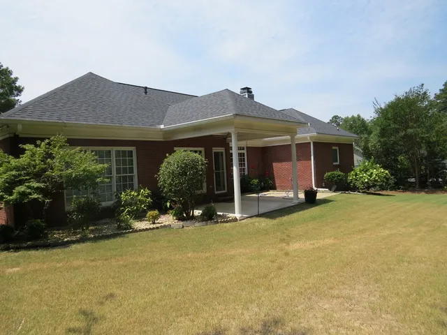a view of an ocean and a yard