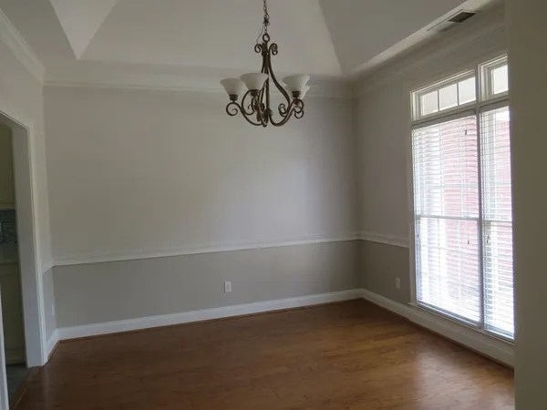 an empty room with a empty space and a window