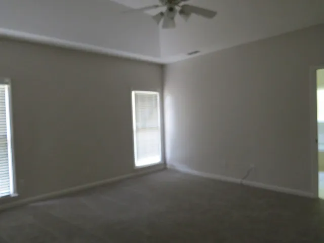 a bath tub sitting next to a window