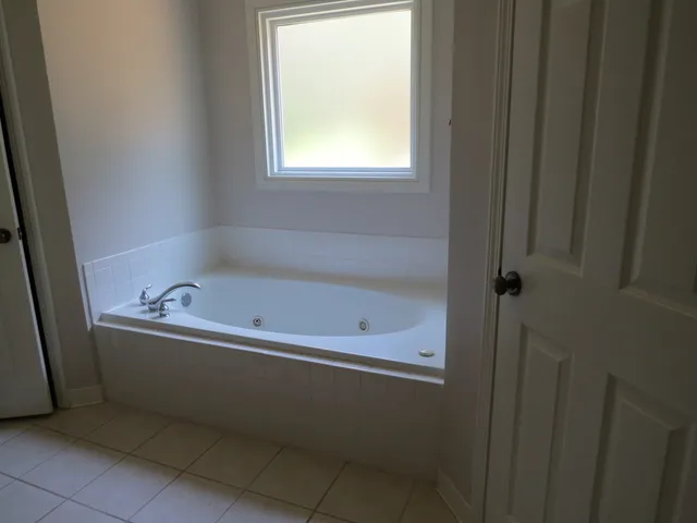a bathroom with a sink a mirror and a shower