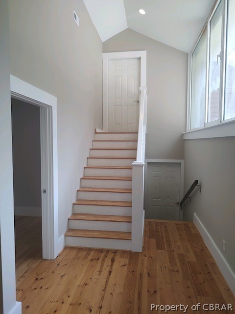 173 Lillys Neck Road Moon, VA 23119 - Photo 36 of 48 Stairway with lofted ceiling and light hardwood / wood-style flooring