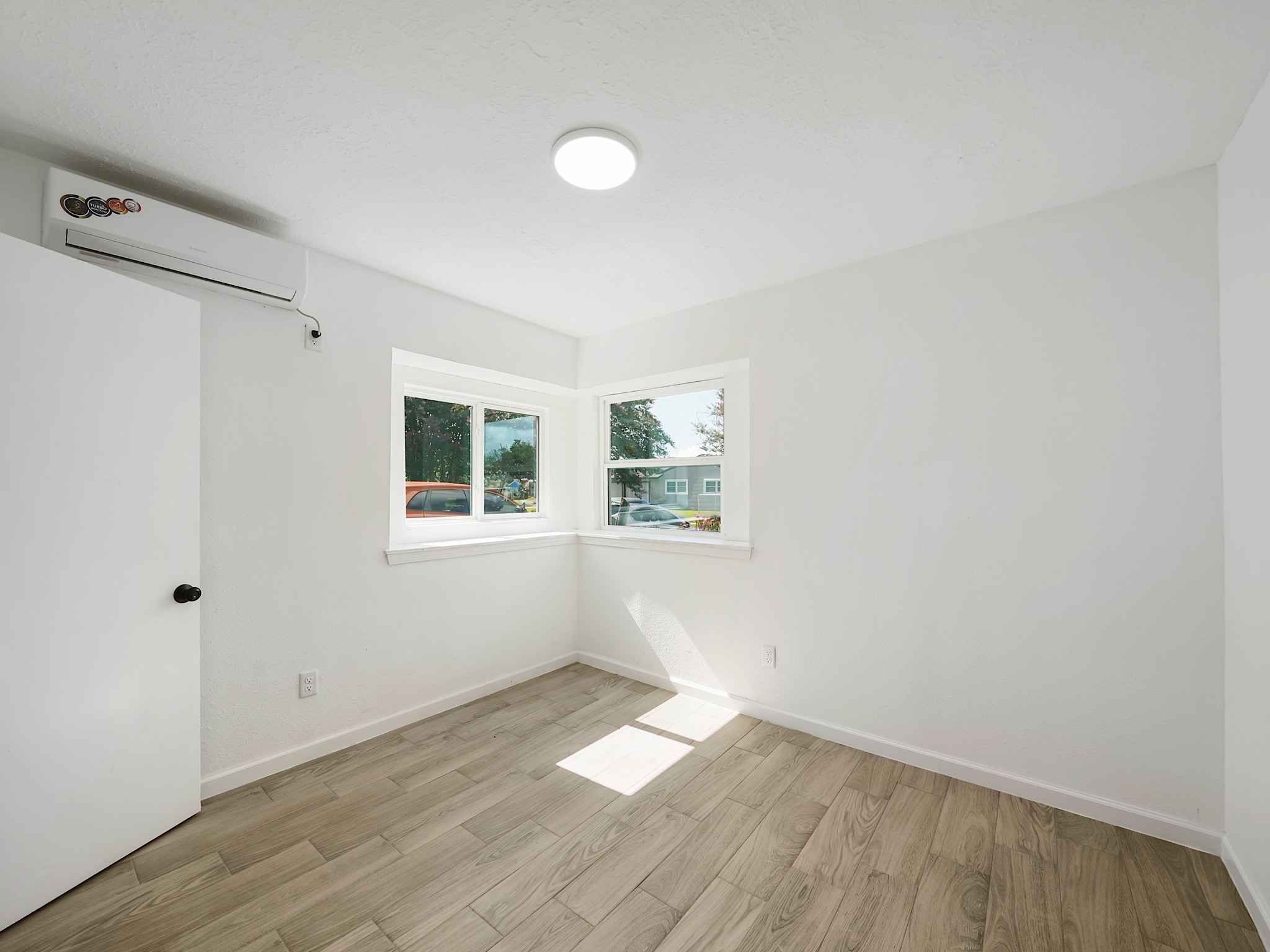 3607 Marchant Road Houston, TX 77047 - Photo 11 of 18 a view of empty room with wooden floor and fan