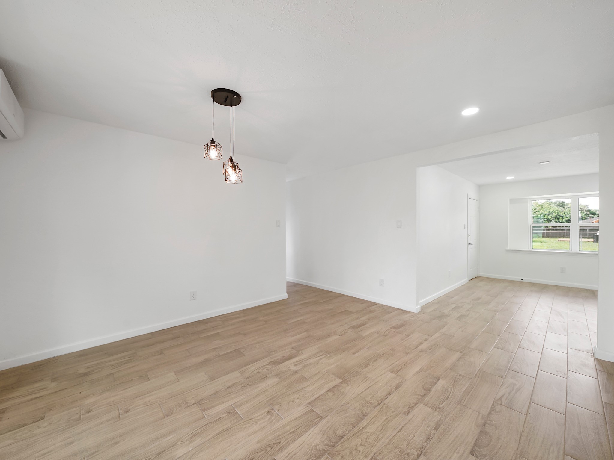3607 Marchant Road Houston, TX 77047 - Photo 15 of 18 a view of a room with wooden floor and fan