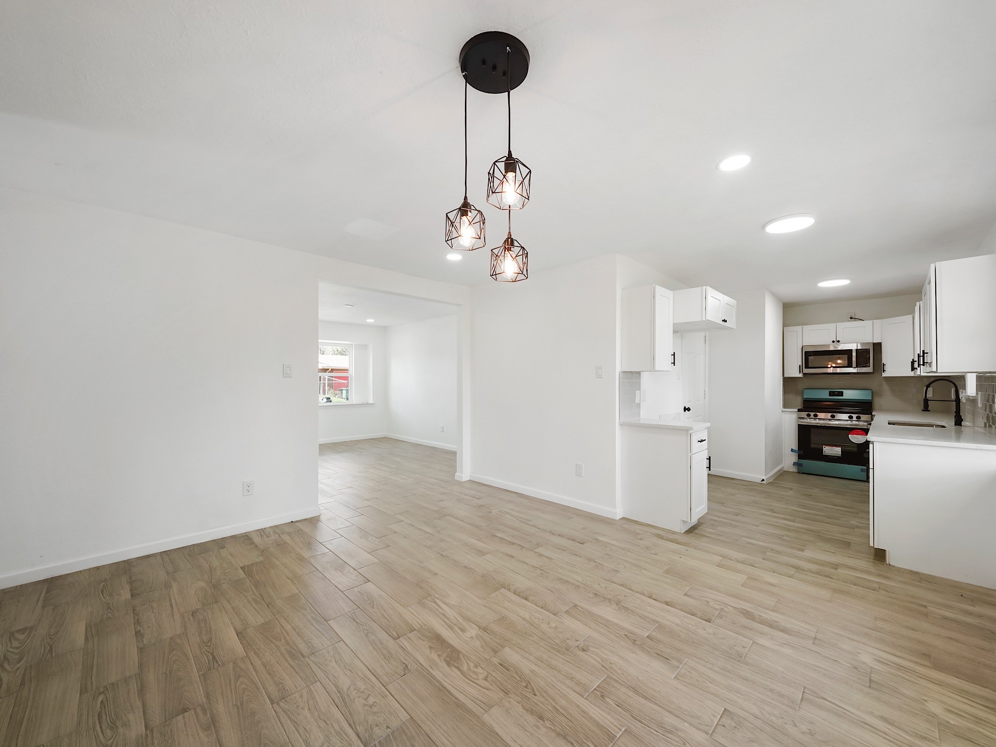 3607 Marchant Road Houston, TX 77047 - Photo 8 of 18 a view of a dining room with furniture and a chandelier