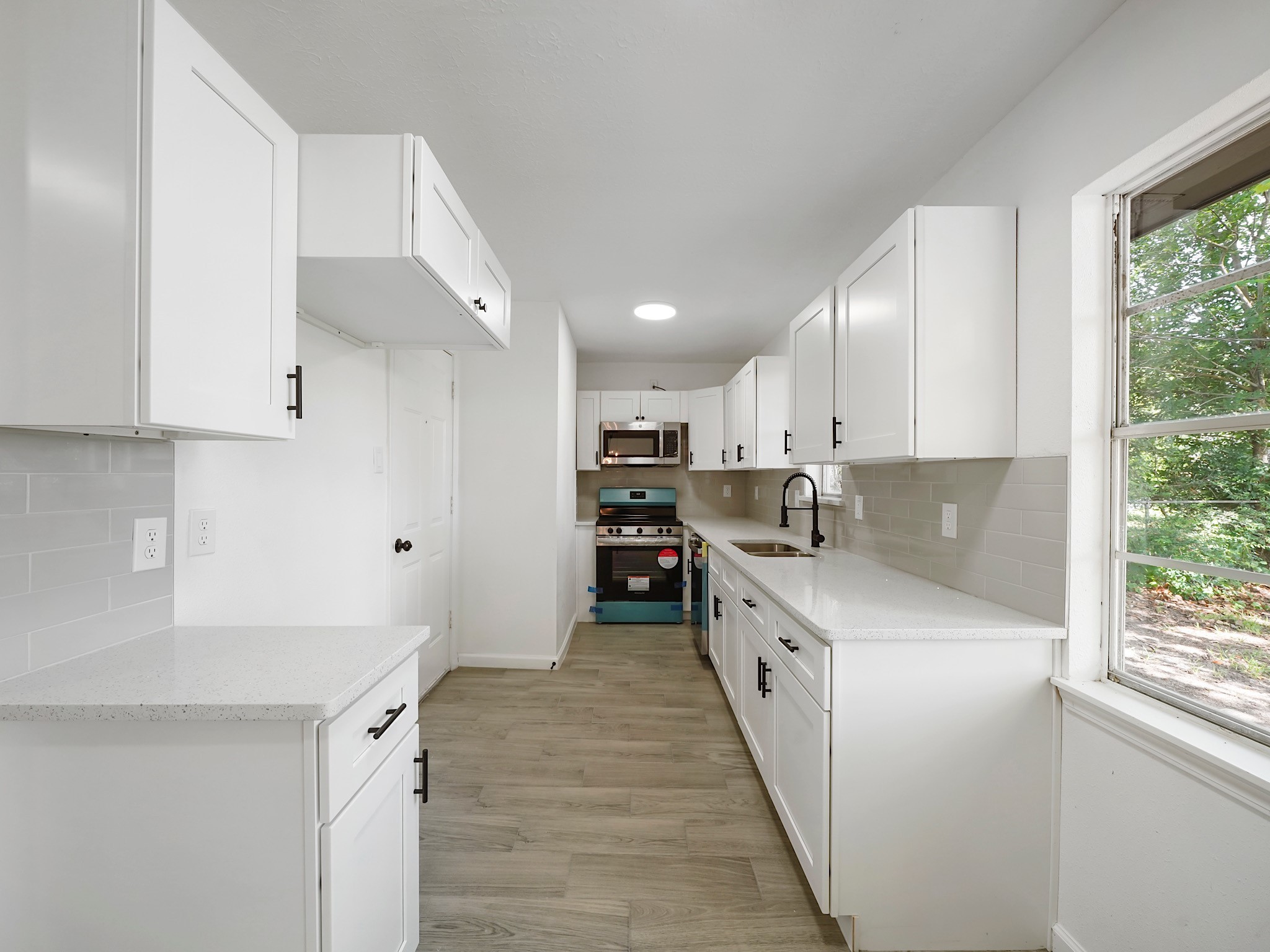 3607 Marchant Road Houston, TX 77047 - Photo 9 of 18 a large white kitchen with a large window