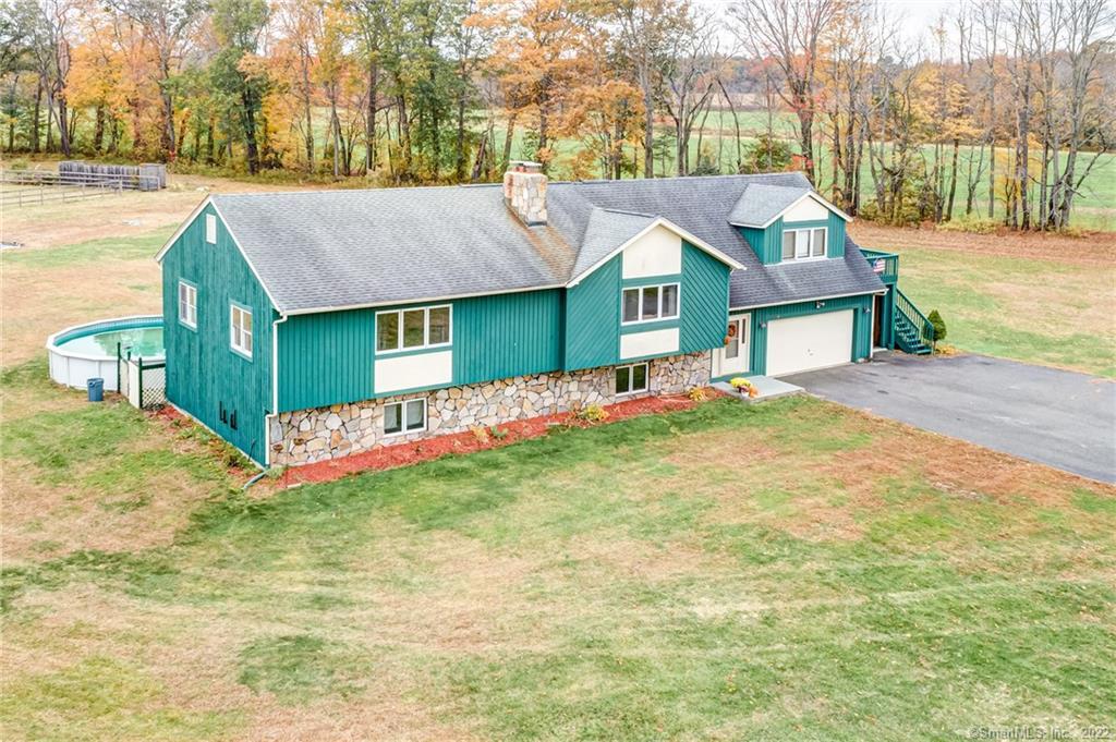 159 Durkee Road Somers, CT 06071 - Photo 1 of 1 a front view of a house with a yard and garage