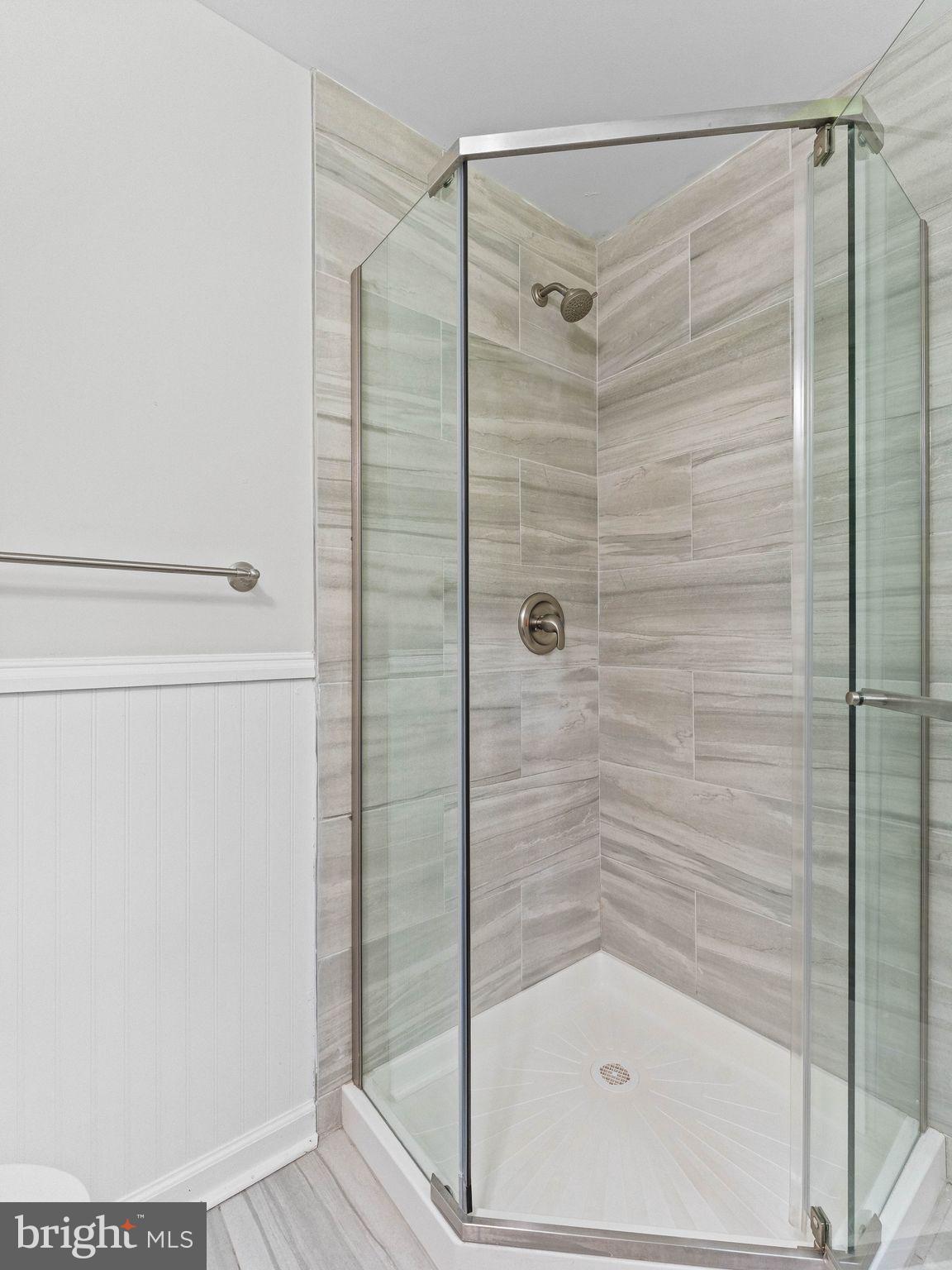 166 Pearl Croft Road Cherry Hill, NJ 08034 - Photo 23 of 34 Sleek modern shower with elegant tiles.