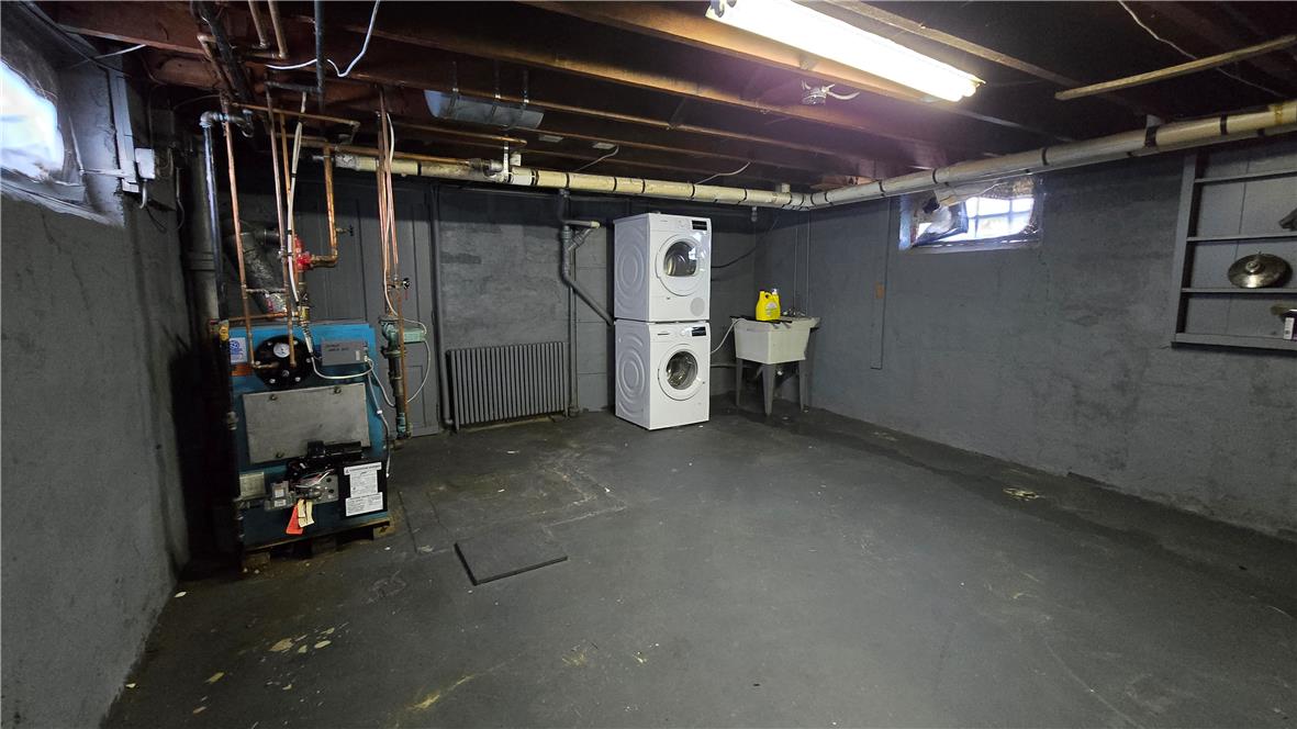 883 North Locust Street Hazleton, PA 18201 - Photo 77 of 83 A functional basement space featuring laundry appliances and utility infrastructure.