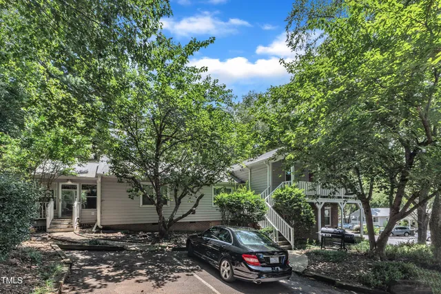 a car parked in front of a house