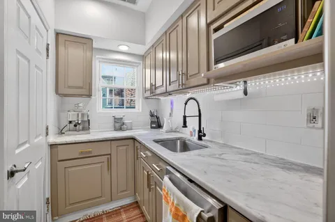 a kitchen with a sink and cabinets
