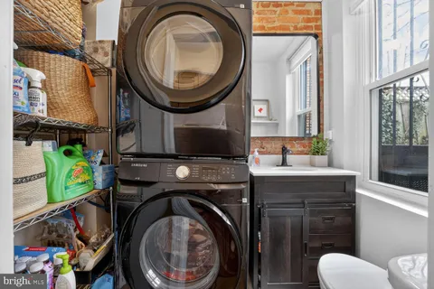 a bathroom with a toilet a sink and a mirror