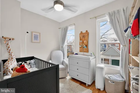 a bedroom with furniture and a window