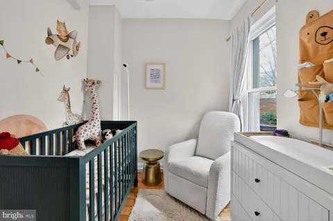 a living room with furniture fireplace and a window