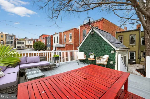 a balcony view with a seating space