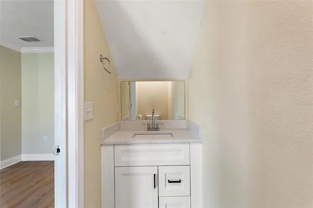 a bathroom with a sink and a mirror