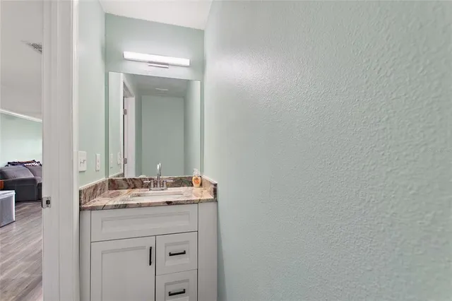a bathroom with a sink and a mirror