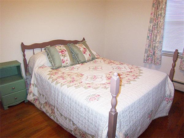 40 Donbray Road Springfield, MA 01119 - Photo 11 of 15 a bed sitting in a bedroom next to a window
