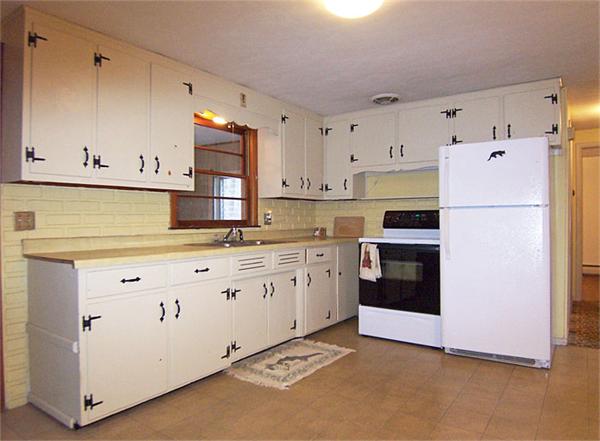 40 Donbray Road Springfield, MA 01119 - Photo 2 of 15 a kitchen with granite countertop white cabinets and white appliances