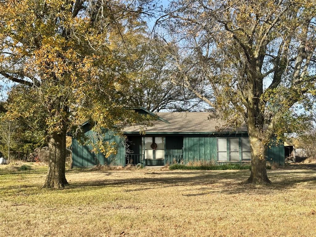527 County Road 2145 Telephone, TX 75488 - Photo 1 of 1 a view of a house with a yard and tree s
