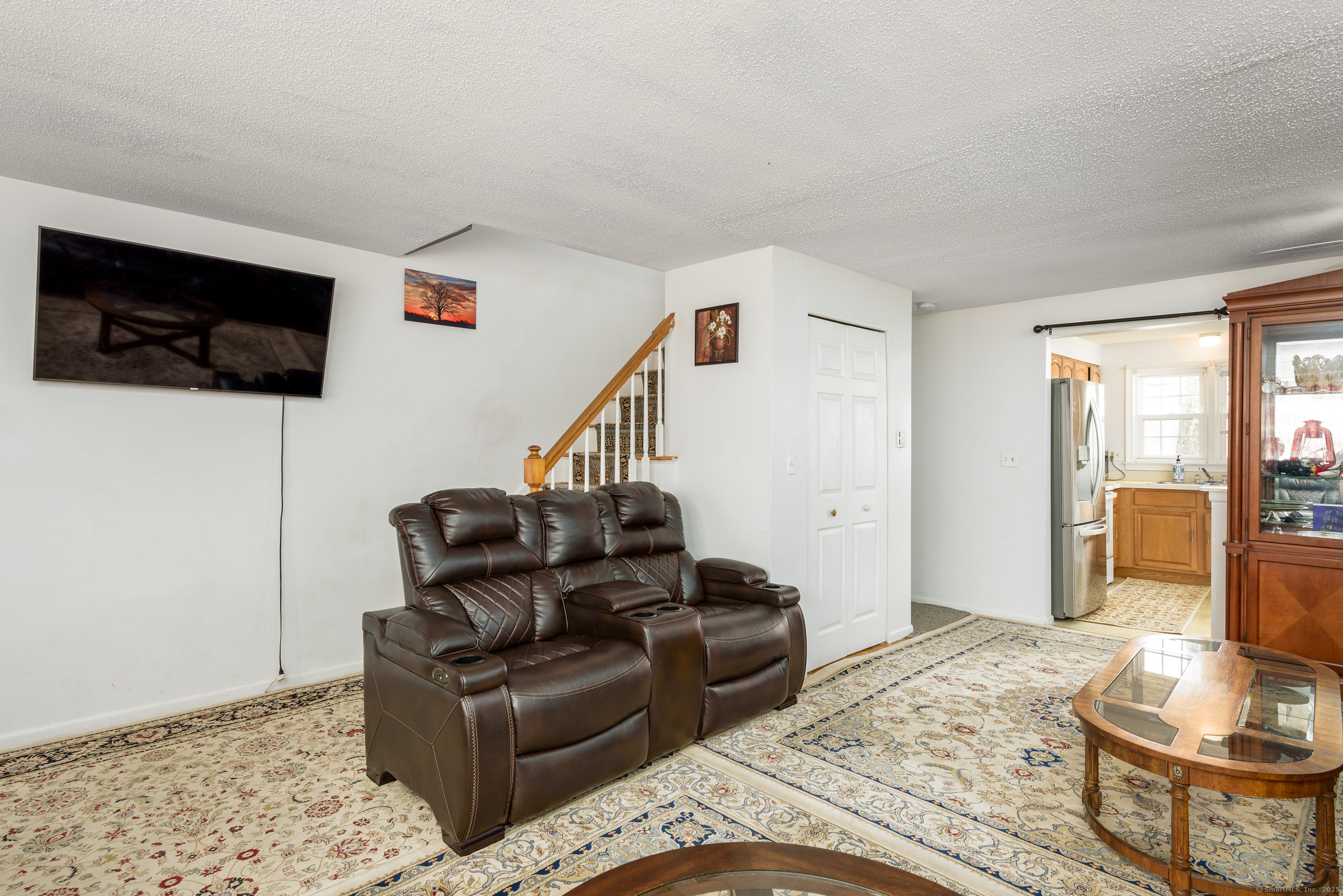 280 East Main Street, Unit E6 Clinton, CT 06413 - Photo 13 of 33 a living room with furniture and a flat screen tv