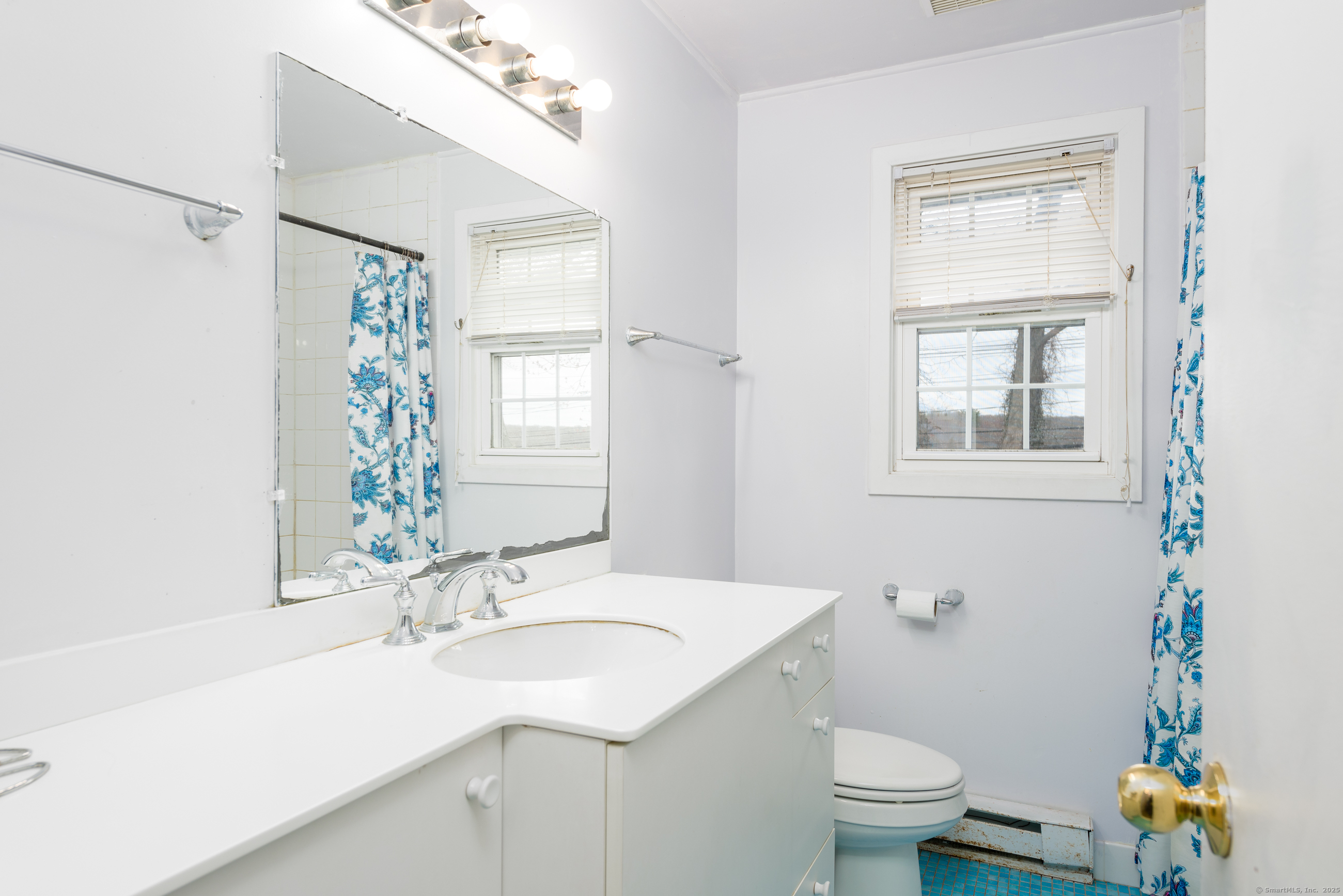 280 East Main Street, Unit E6 Clinton, CT 06413 - Photo 25 of 33 a bathroom with a sink toilet and a mirror