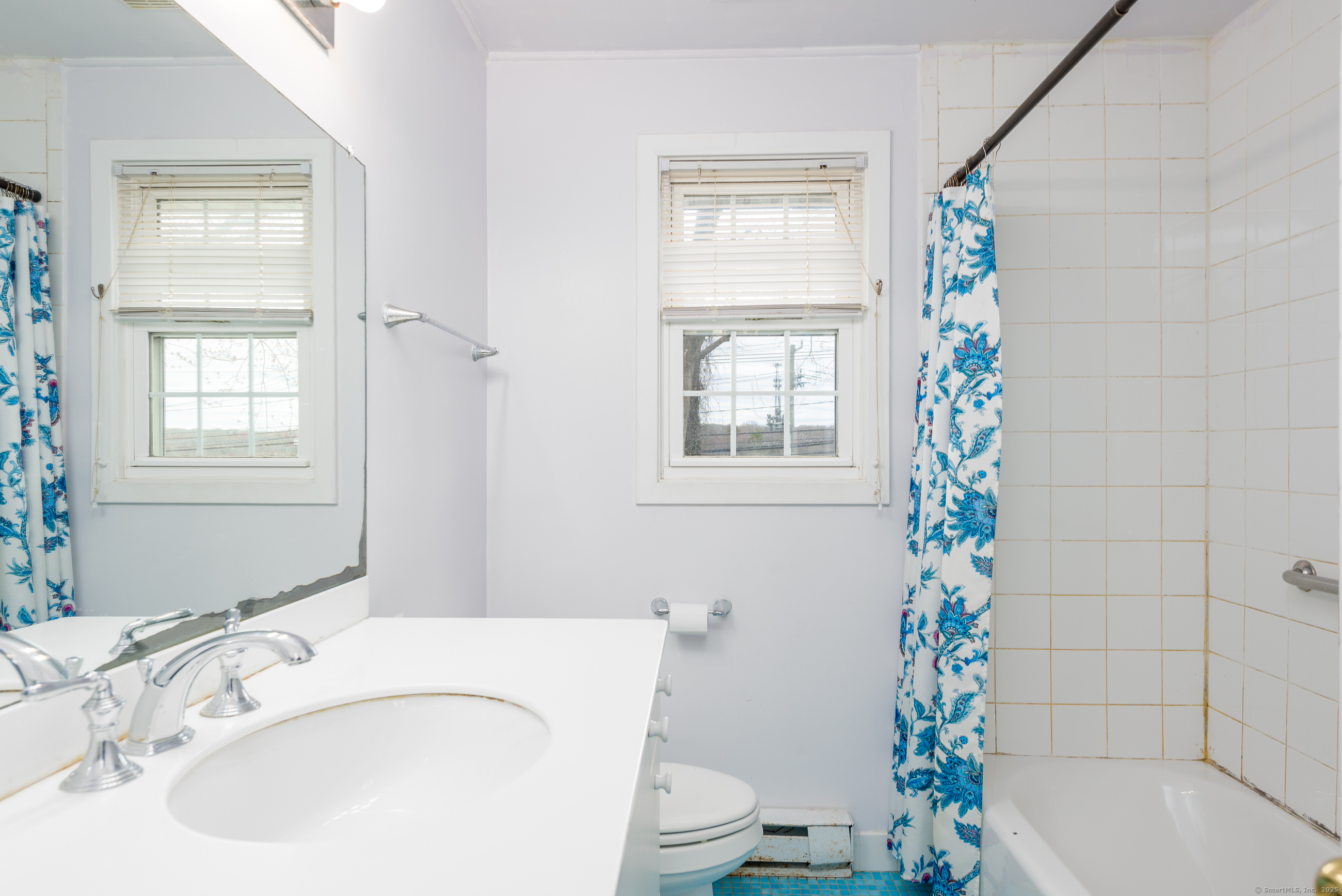 280 East Main Street, Unit E6 Clinton, CT 06413 - Photo 26 of 33 a bath room with a sink and a toilet