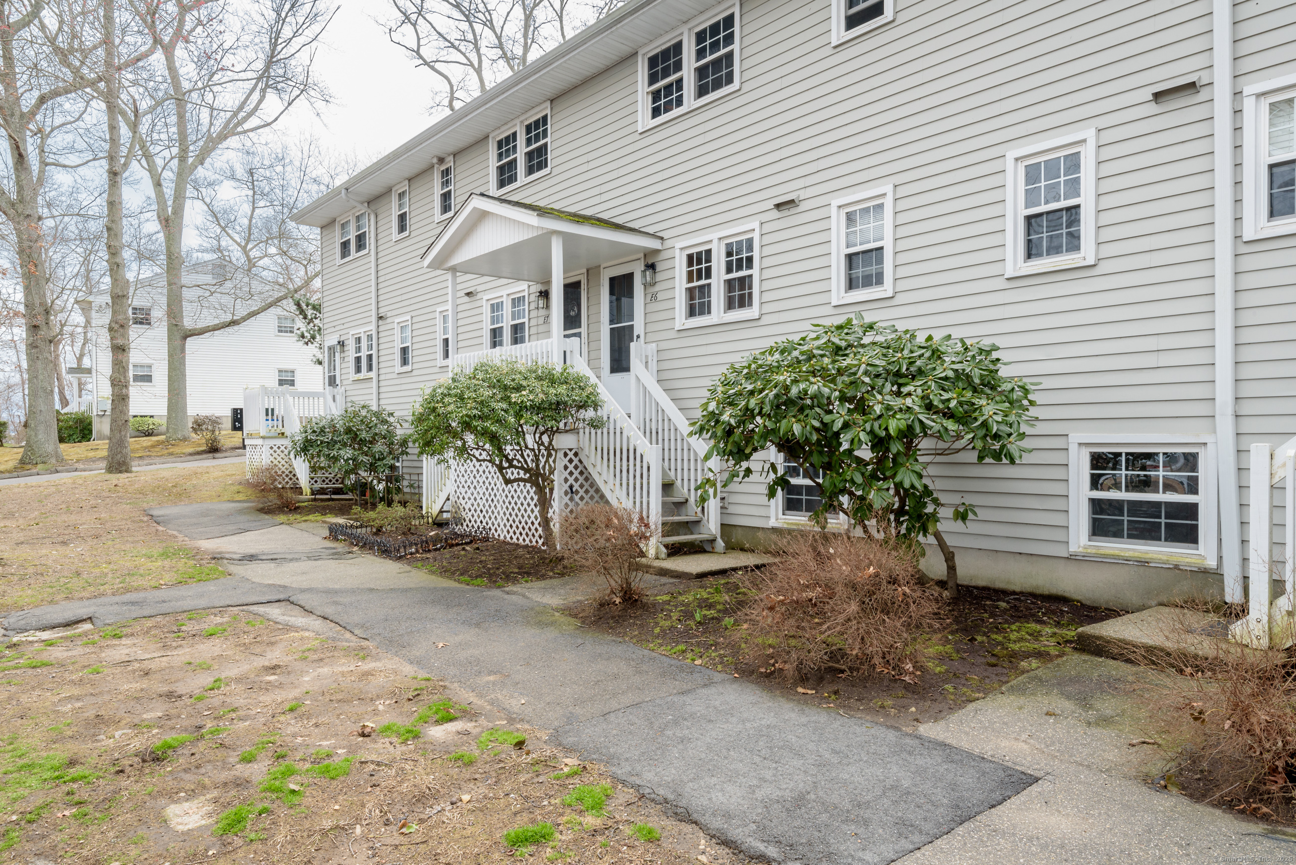 280 East Main Street, Unit E6 Clinton, CT 06413 - Photo 3 of 33 a view of a house with a yard