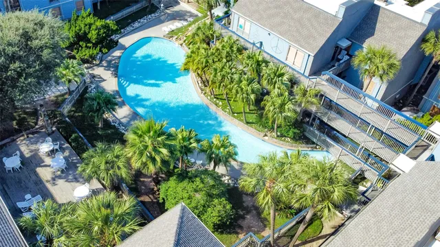a view of a swimming pool with a patio