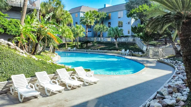 a view of a yard with sitting area