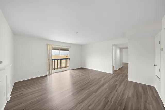 a view of a balcony with wooden floor and stairs