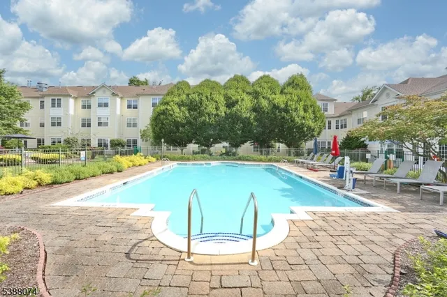 a view of a swimming pool with a lounge chairs