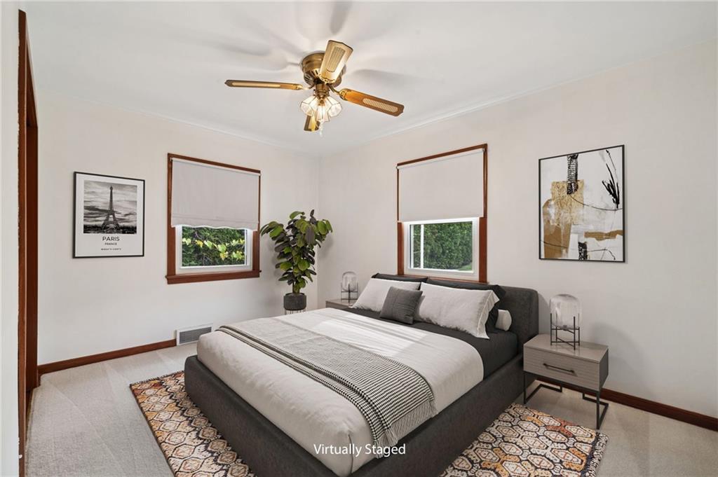 224 Old Rte 217 Derry, PA 15627 - Photo 11 of 47 a bedroom with a large bed and a chandelier