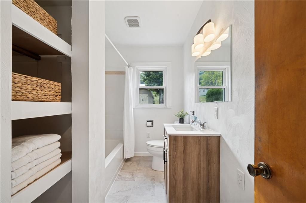 224 Old Rte 217 Derry, PA 15627 - Photo 16 of 35 a bathroom with a sink a toilet and window