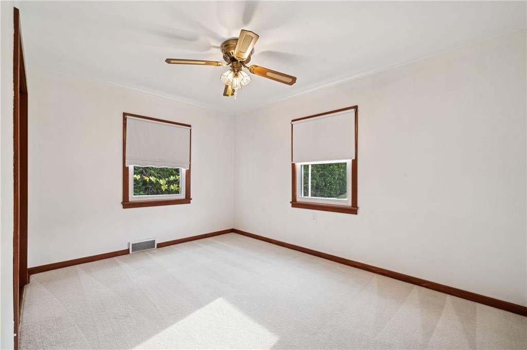 224 Old Rte 217 Derry, PA 15627 - Photo 19 of 35 an empty room with windows and fan