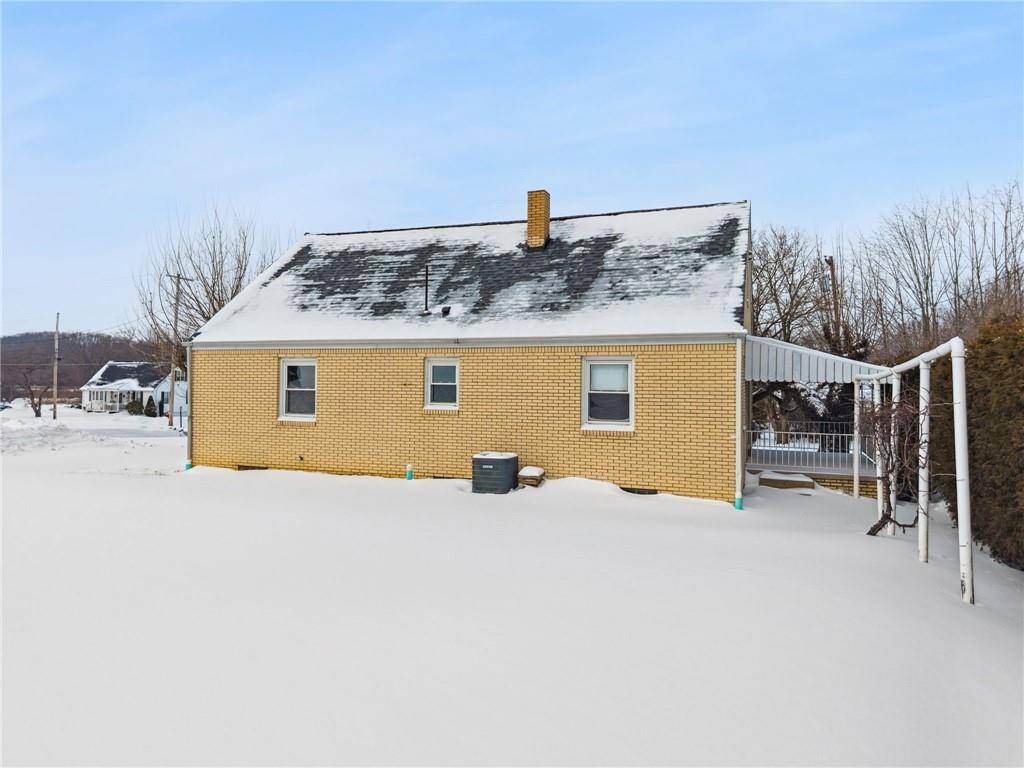 224 Old Rte 217 Derry, PA 15627 - Photo 31 of 35 a view of a house with a yard covered in snow