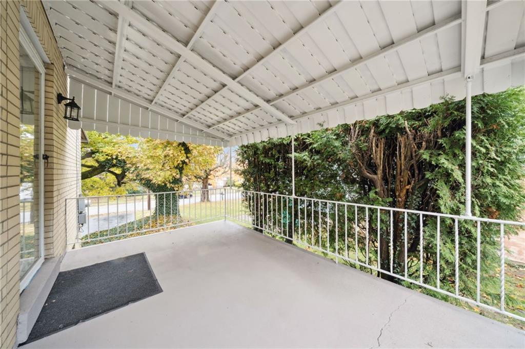 224 Old Rte 217 Derry, PA 15627 - Photo 39 of 47 a view of balcony with floor to ceiling window and wooden fence