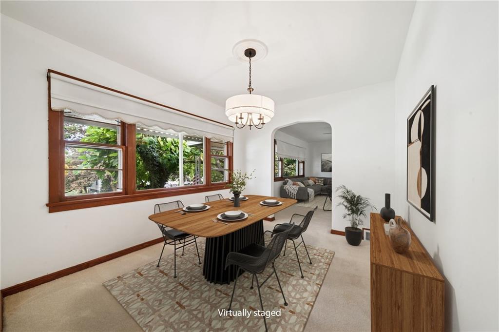 224 Old Rte 217 Derry, PA 15627 - Photo 5 of 47 a dining room with wooden floor a chandelier a wooden table and chairs