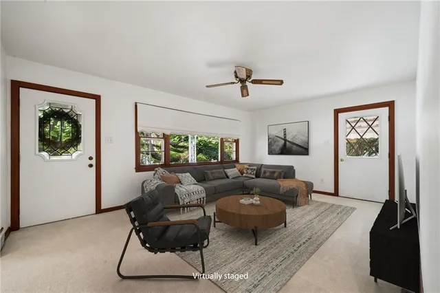 a living room with furniture and a window