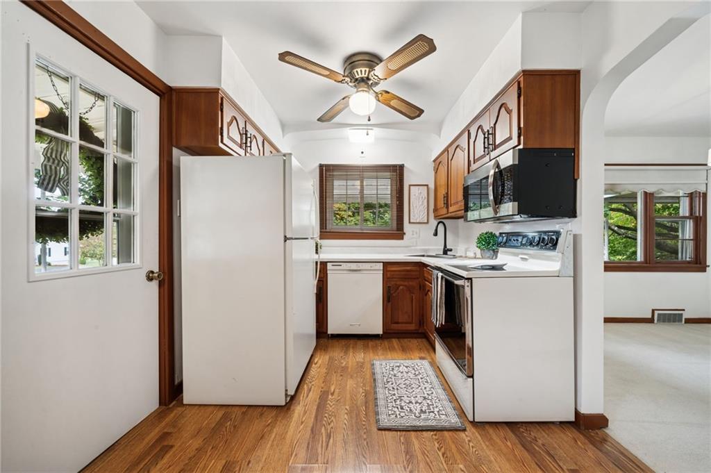 224 Old Rte 217 Derry, PA 15627 - Photo 6 of 35 a kitchen with a refrigerator a stove top oven a sink and a large window