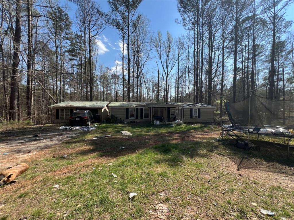 a view of a swimming pool with sitting area