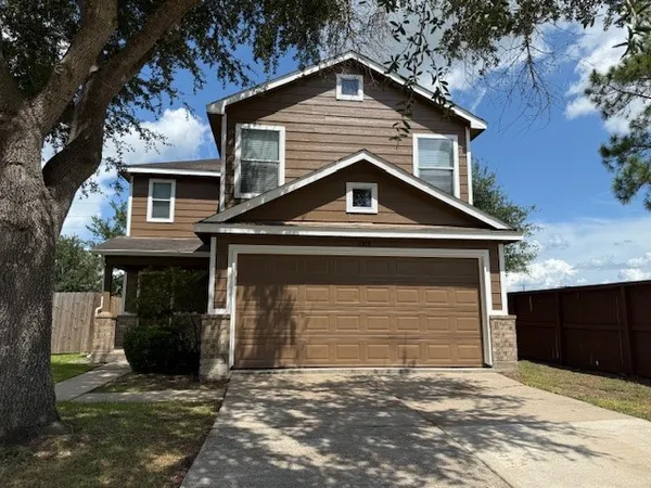 a front view of a house with a garage