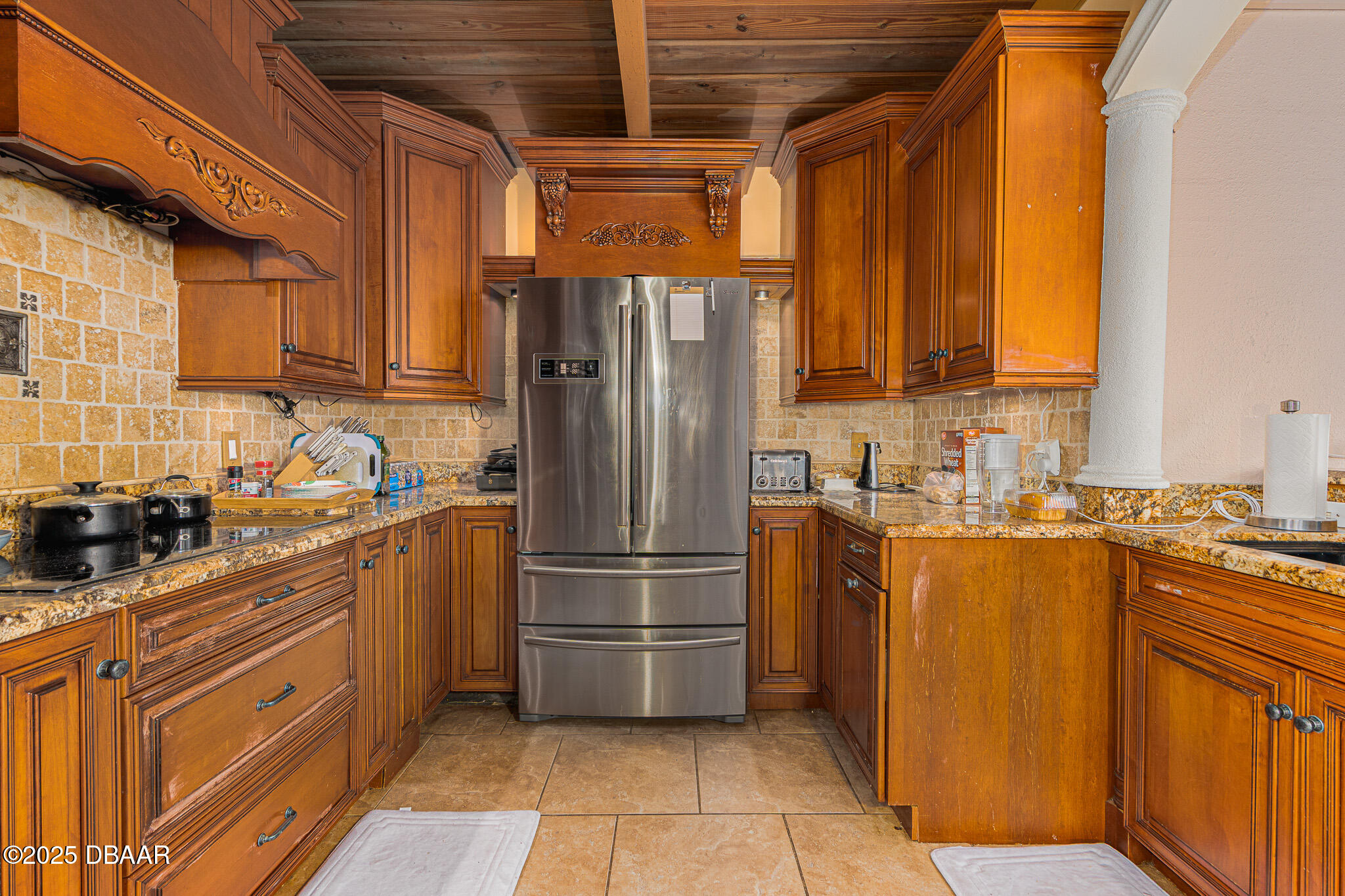 46 Oceanview Avenue Ponce Inlet, FL 32127 - Photo 16 of 79 a kitchen with stainless steel appliances granite countertop a refrigerator a sink a stove and washer