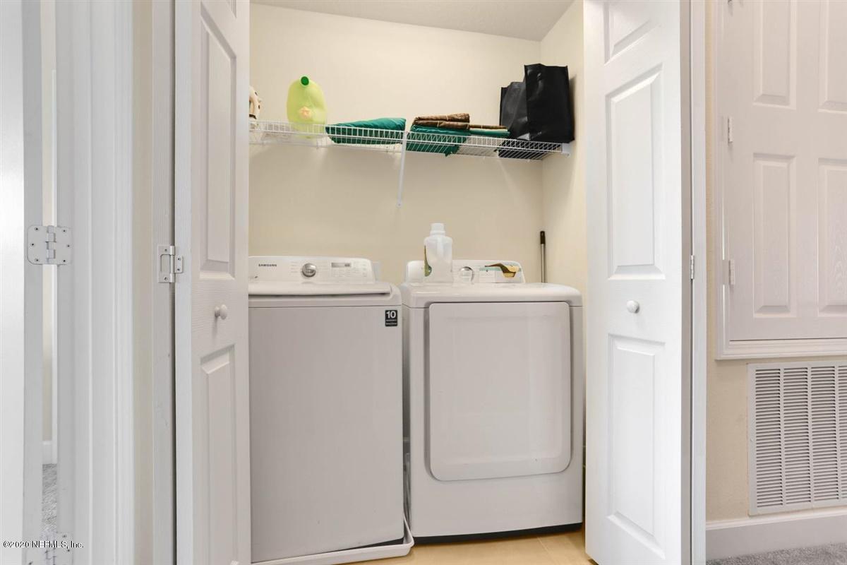 6864 Roundleaf Drive Jacksonville, FL 32258 - Photo 14 of 17 a utility room with dryer and washer