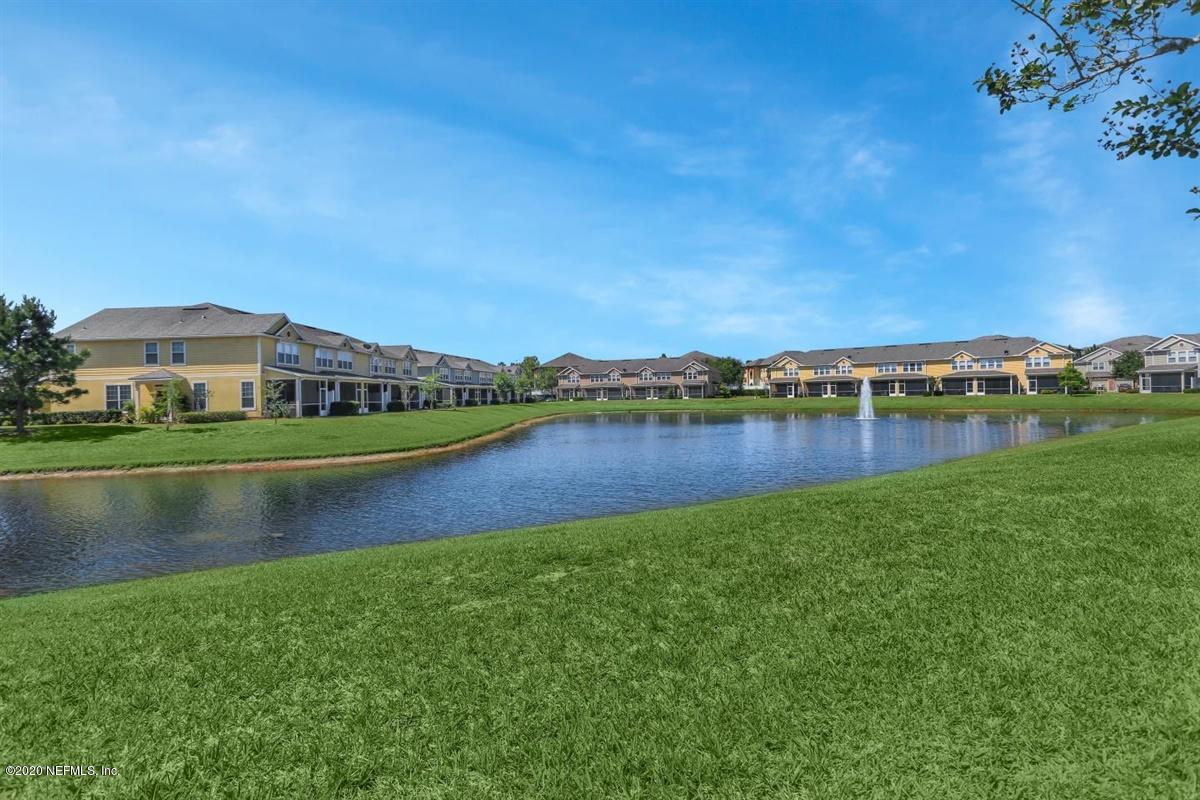 6864 Roundleaf Drive Jacksonville, FL 32258 - Photo 17 of 17 a view of a lake with houses in the background