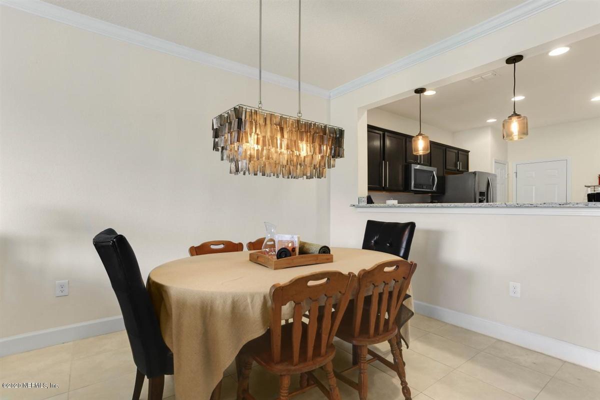 6864 Roundleaf Drive Jacksonville, FL 32258 - Photo 5 of 17 a dining room with furniture and chandelier kitchen view