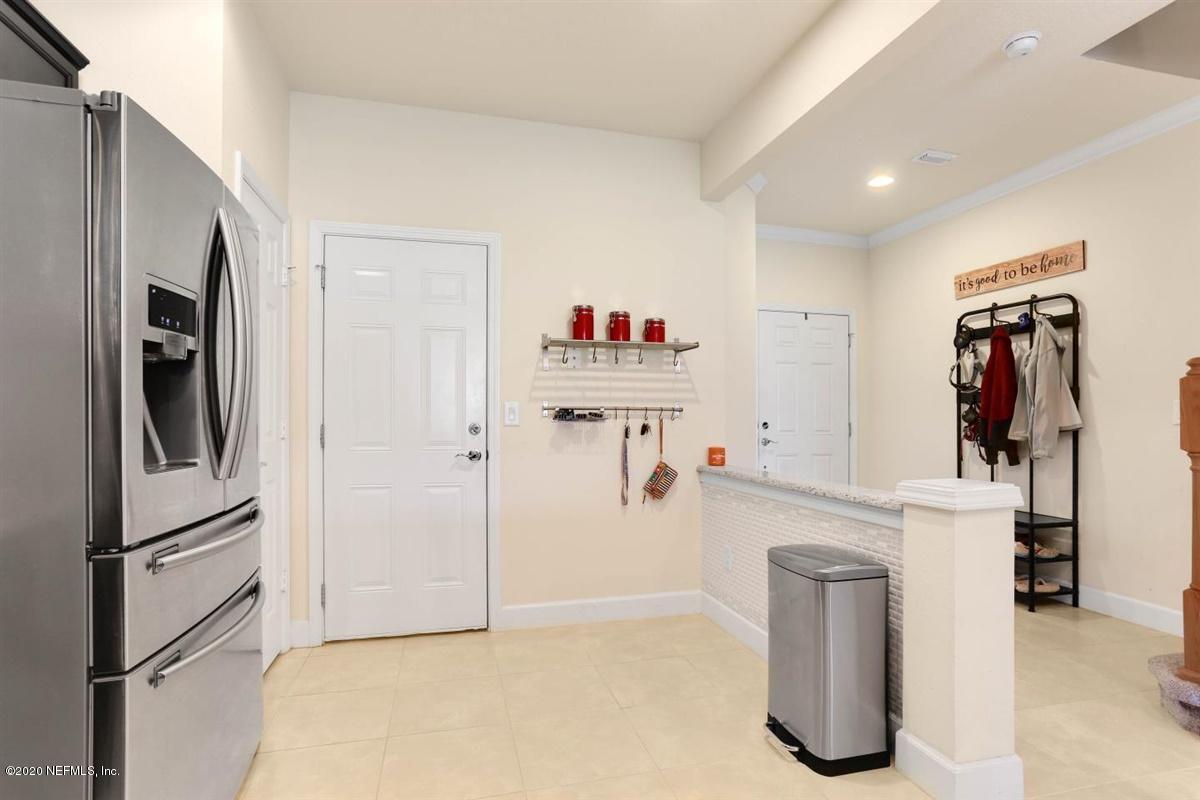 6864 Roundleaf Drive Jacksonville, FL 32258 - Photo 8 of 17 a kitchen with refrigerator and cabinets