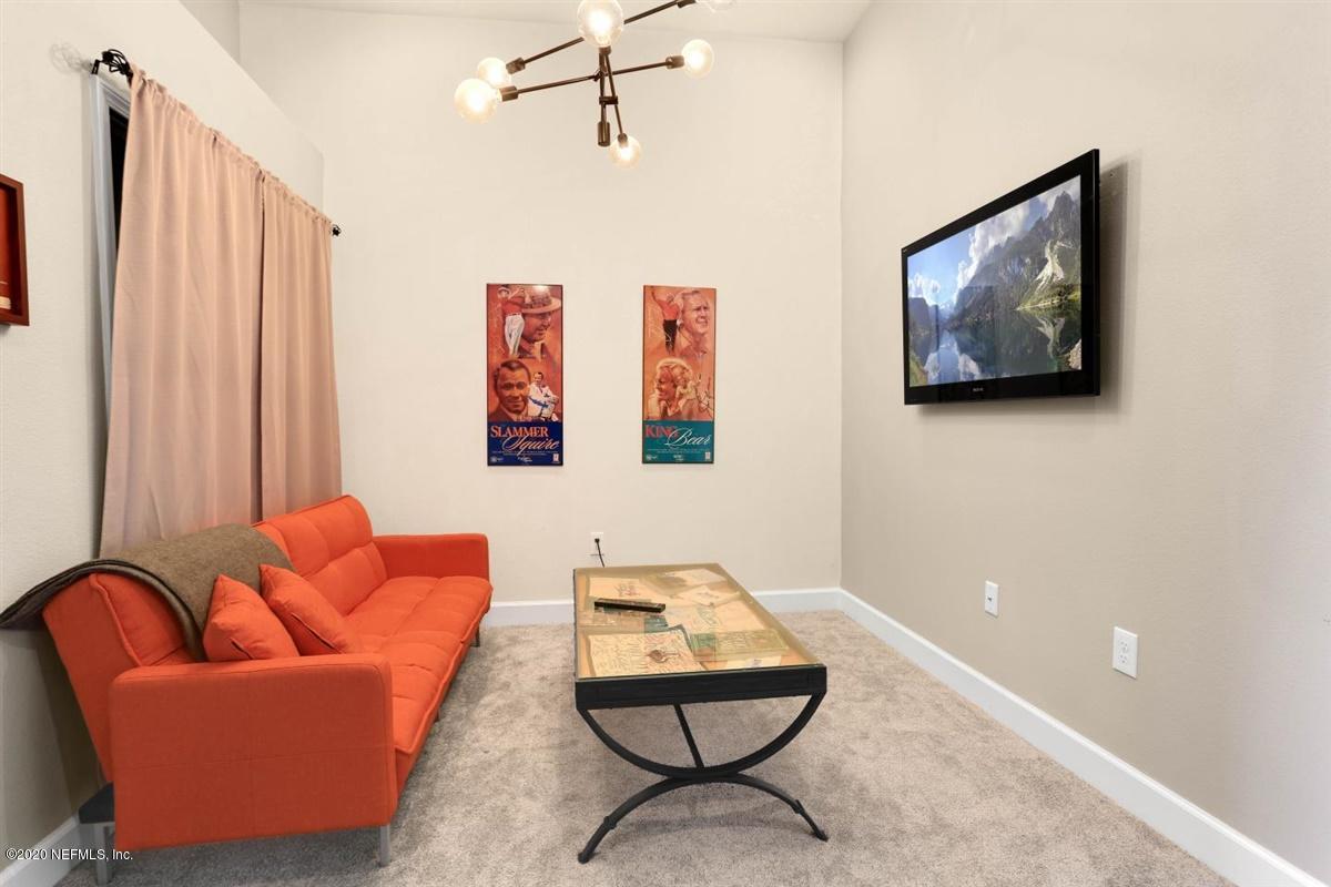 6864 Roundleaf Drive Jacksonville, FL 32258 - Photo 9 of 17 a room with furniture and air hockey table